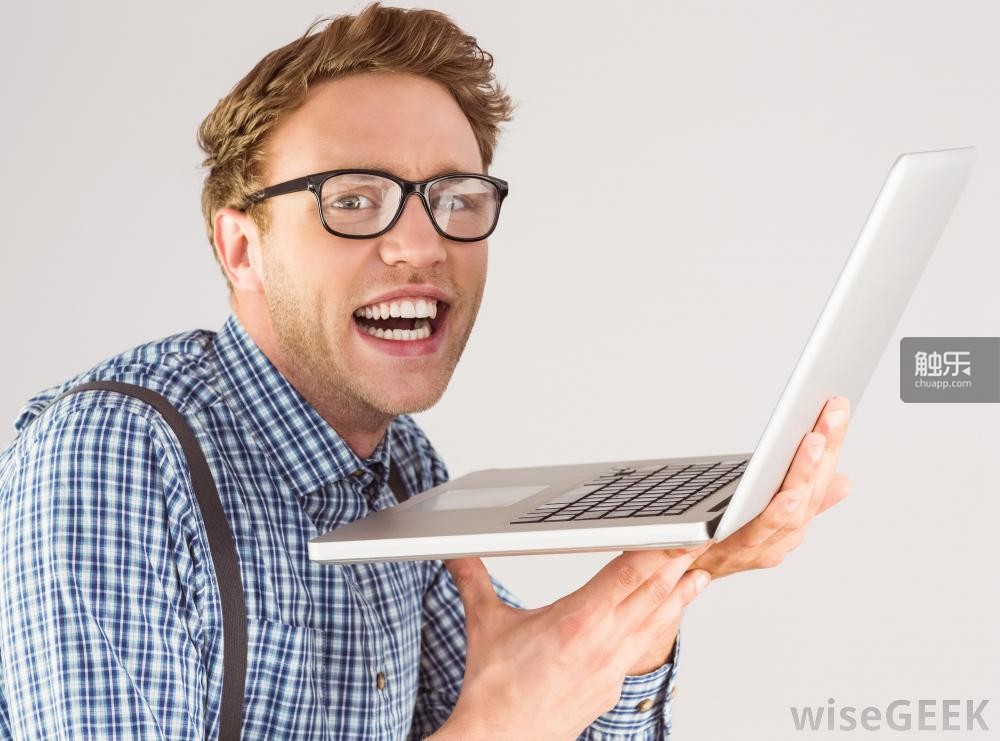 nerdy-man-in-checkered-shirt-with-computer